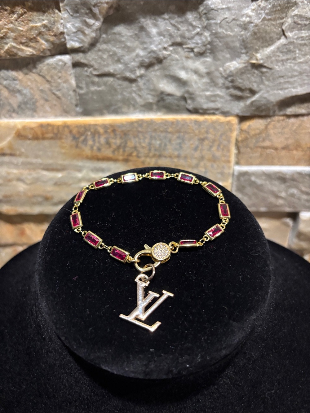Gold Bracelet with Red Rectangular Stones and LV Charm